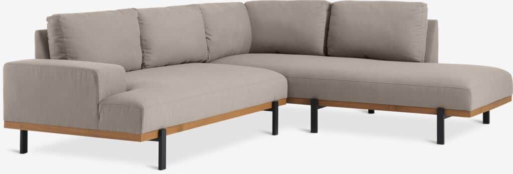 A sectional sofa with a light beige fabric upholstery. It features a modular design with a chaise lo… — 3D model
