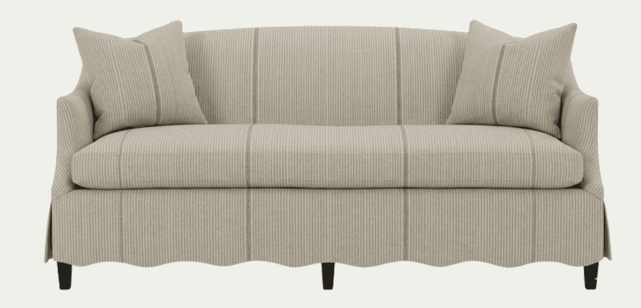 A sofa upholstered in a striped fabric with a scalloped bottom edge. It features two matching throw… — free GLTF 3D model