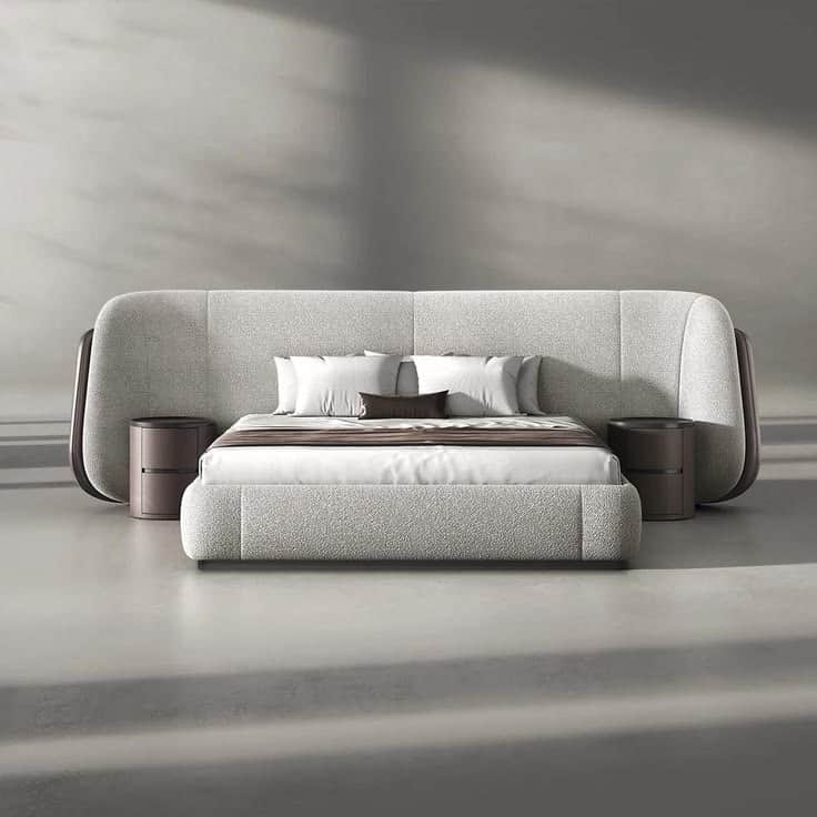 A modern, low-profile upholstered bed system featuring a wide, curved headboard with integrated circ… — free STL 3D model