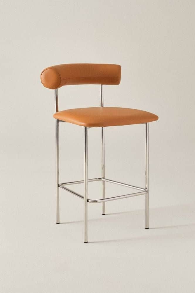 A modern bar stool featuring a polished chrome-plated tubular steel frame, upholstered in tan leathe… — 3D model
