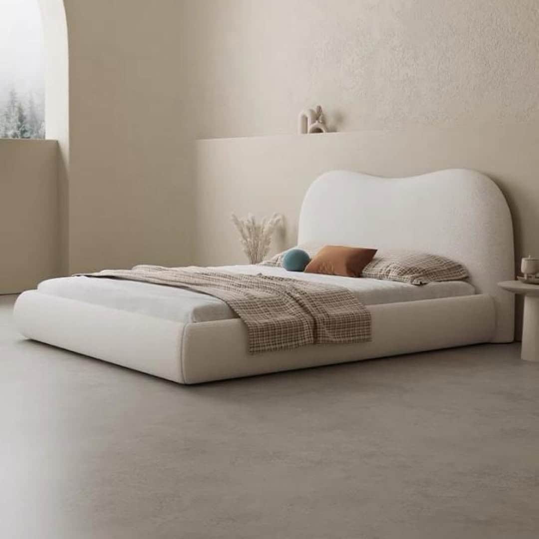 A modern upholstered platform bed featuring a soft, off-white bouclé fabric covering and a distincti… — 3D model