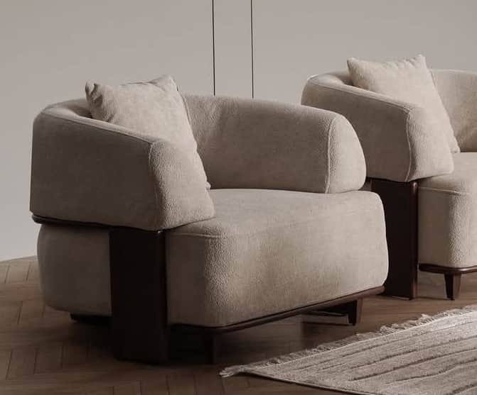 A contemporary upholstered armchair featuring a low-profile design, rounded forms, and distinct dark… — free OBJ 3D model