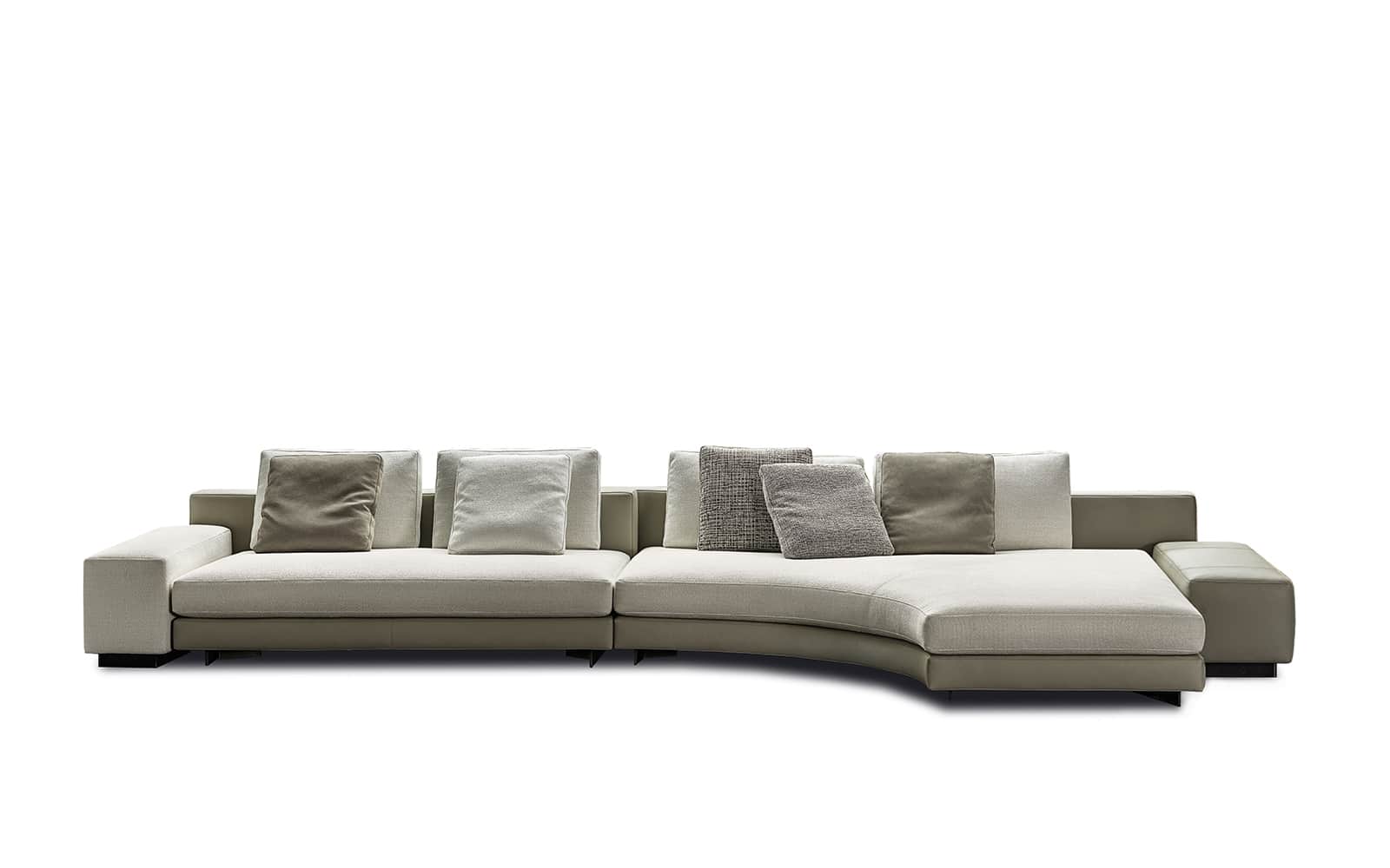 A sectional sofa with a curved chaise lounge section. The sofa features a low profile with wide armr… — 3D model