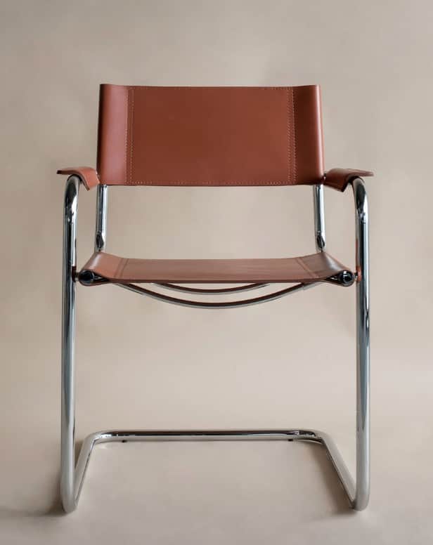 A modern armchair with a tubular chrome frame and leather upholstery. The seat and backrest are made… — 3D model