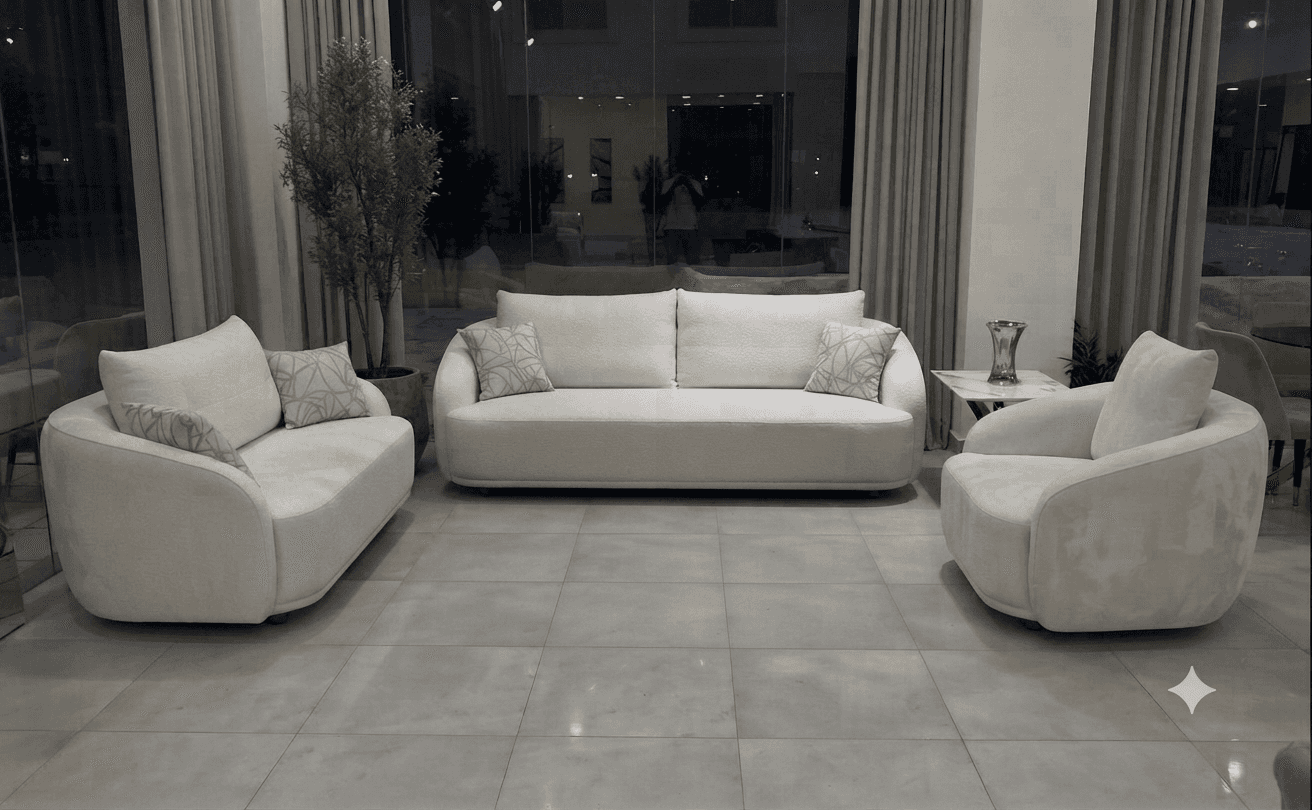 A modern, light beige three-seater sofa with a distinctive curved silhouette, upholstered in a subtl… — free SKP 3D model