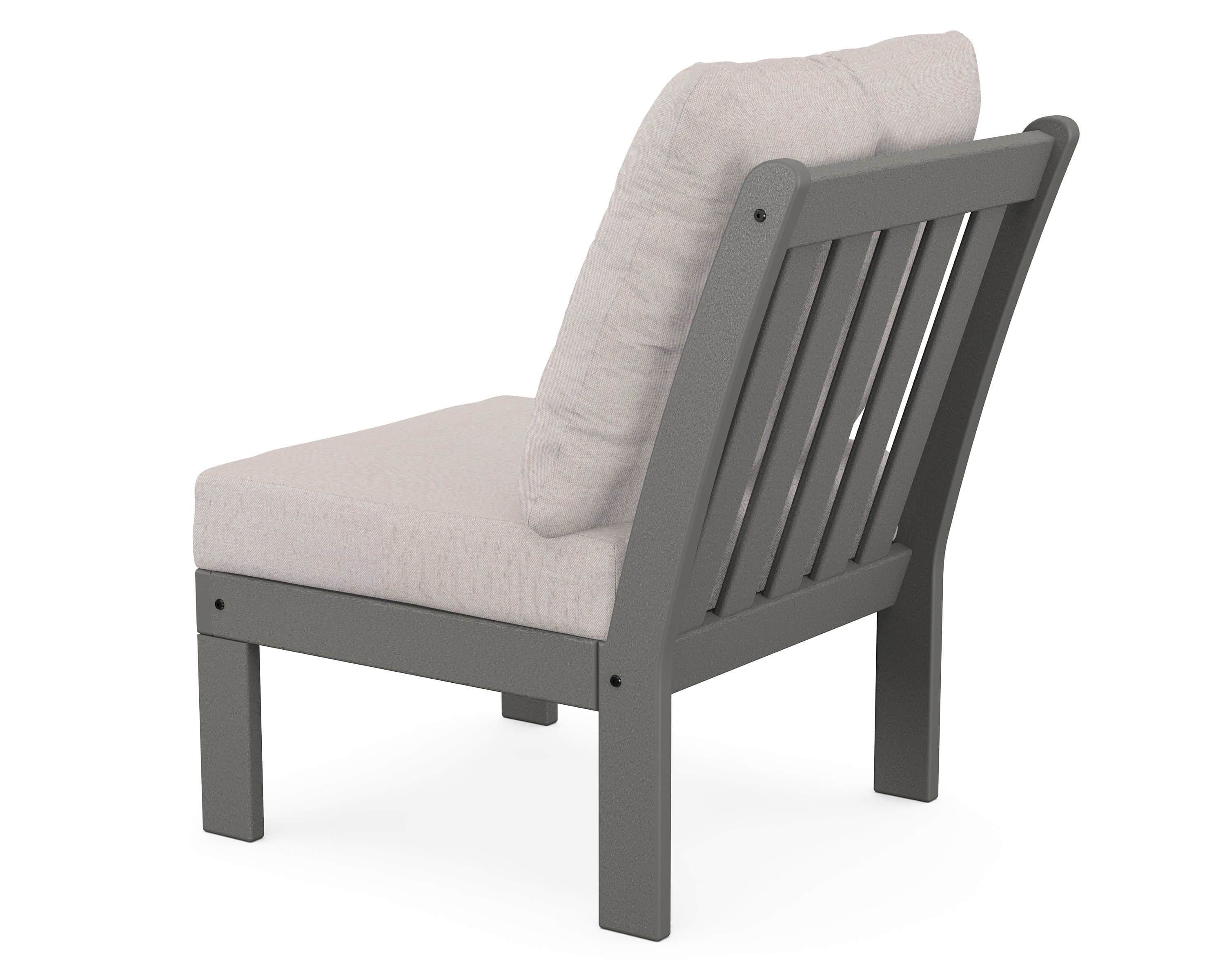 A single armchair with a slatted backrest and upholstered seat and back cushions. The frame appears… — 3D model