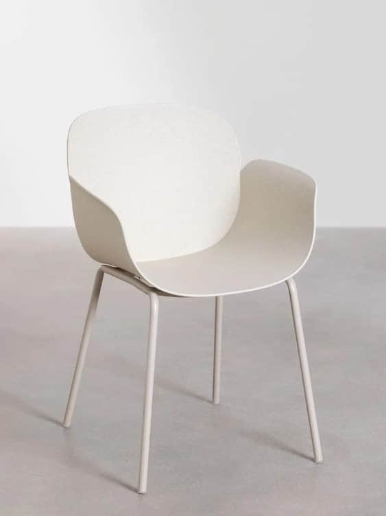 A modern armchair with a molded seat and backrest supported by four slender, tapered metal legs. The… — 3D model