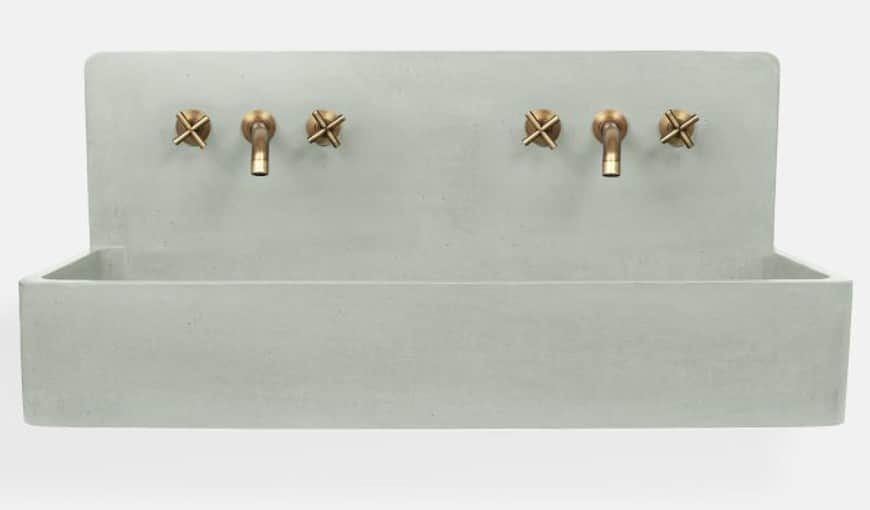 A minimalist, double basin, wall-mounted sink crafted from light grey concrete, featuring two sets o… — 3D model