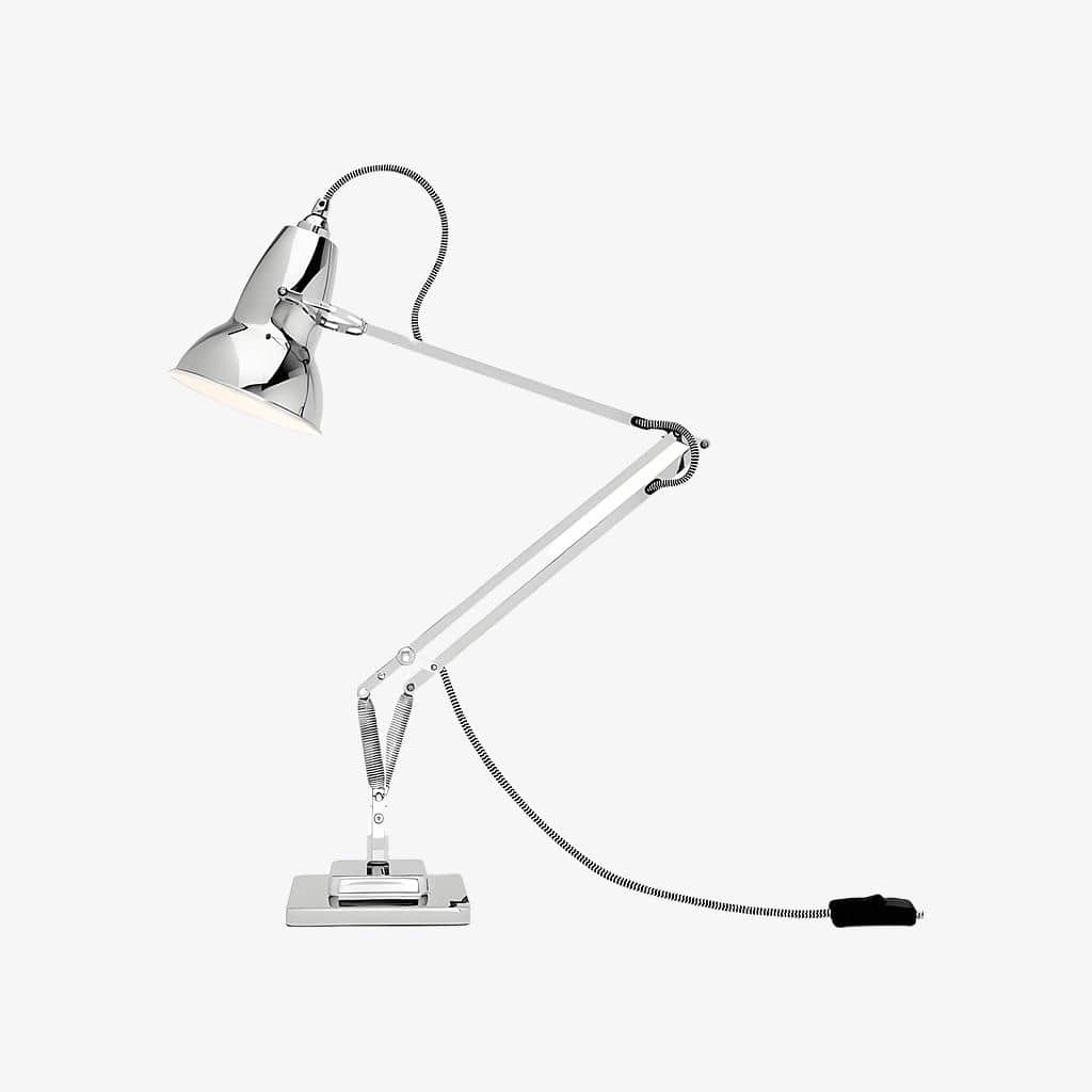 An adjustable desk lamp with an articulated arm, polished chrome shade and base, and spring-balanced… — 3D model