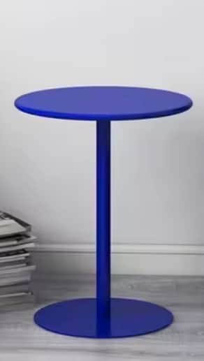A modern side table with a circular tabletop and a single pedestal base, also circular. The table ha… — 3D model