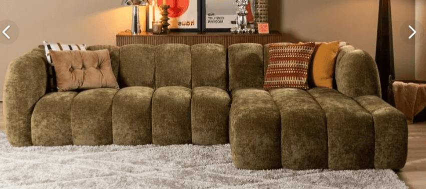 An L-shaped sectional sofa featuring prominent vertical channel tufting across all surfaces, includi… — 3D model