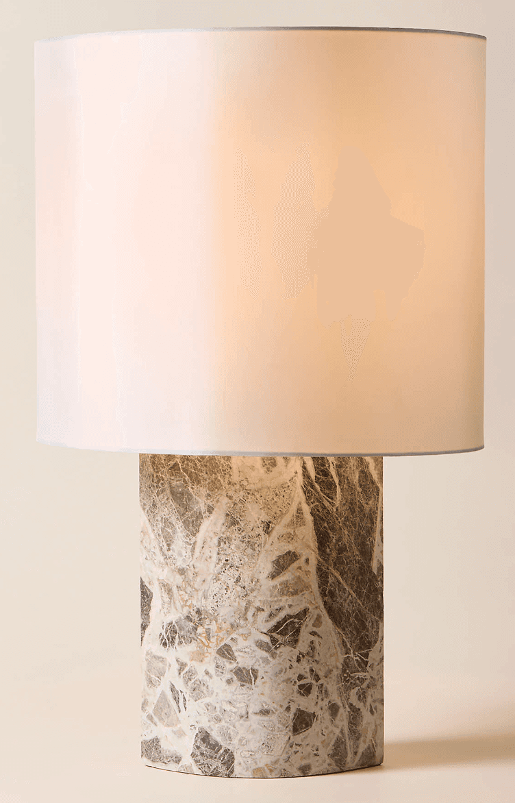 A contemporary table lamp featuring a cylindrical marble base with intricate natural patterns and a… — 3D model