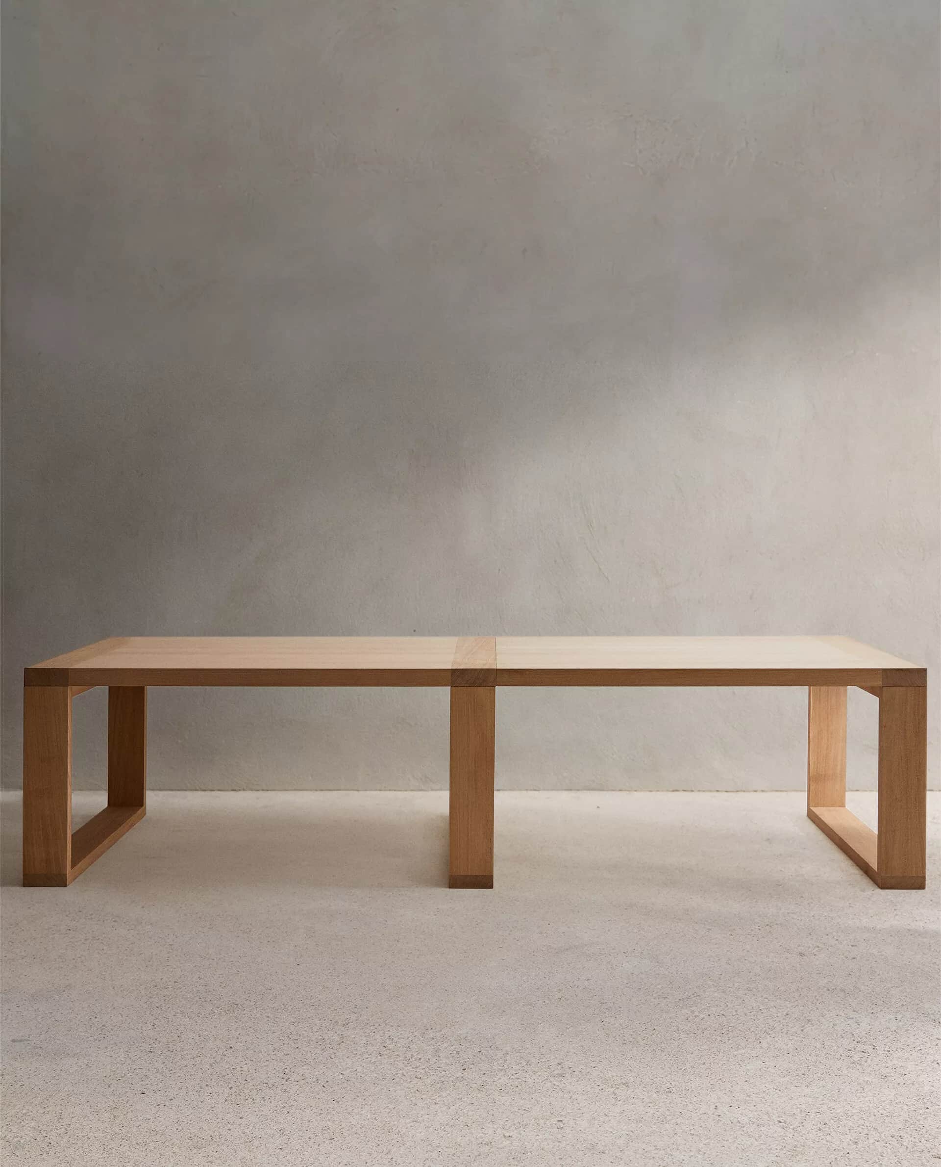 A long, low contemporary wooden bench crafted from light-toned wood, featuring a minimalist design w… — 3D model