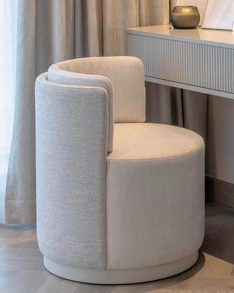 A contemporary barrel lounge chair featuring a fully upholstered, rounded form with a high backrest… — free GLTF 3D model