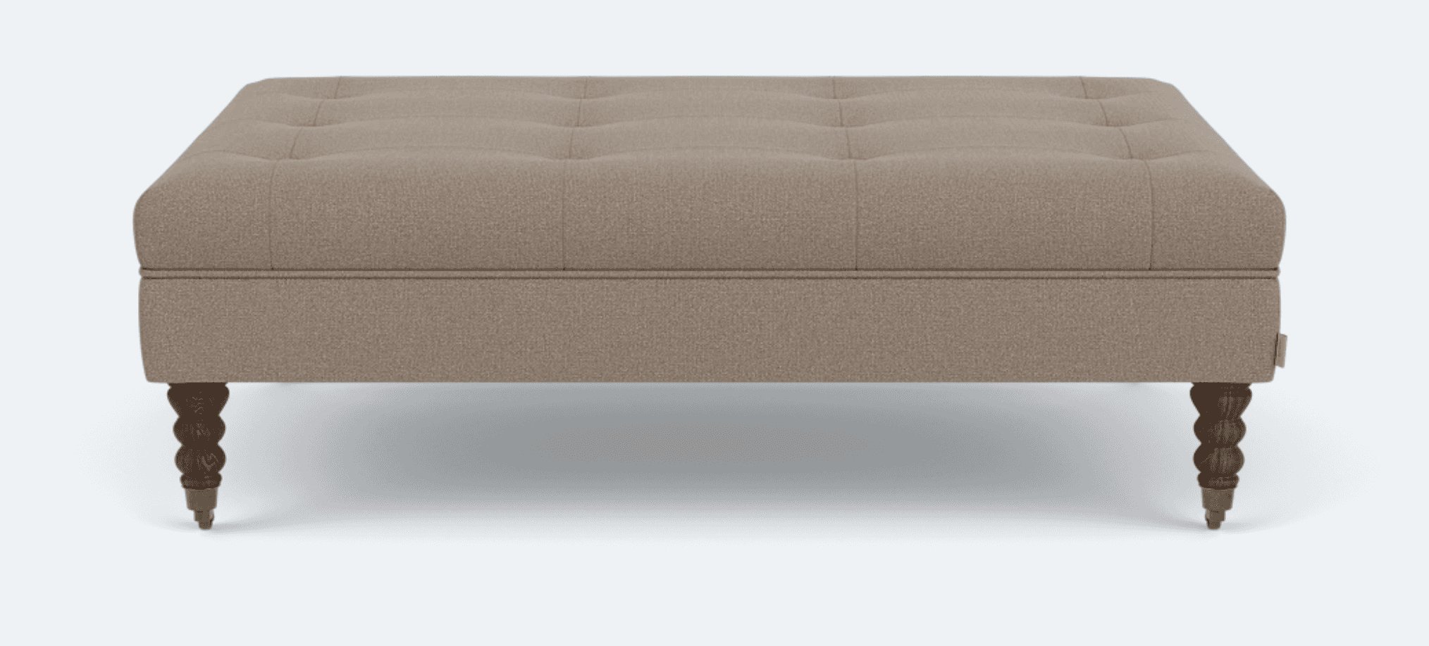 A rectangular ottoman with tufted upholstery and four carved wooden legs. The upholstery appears to… — 3D model