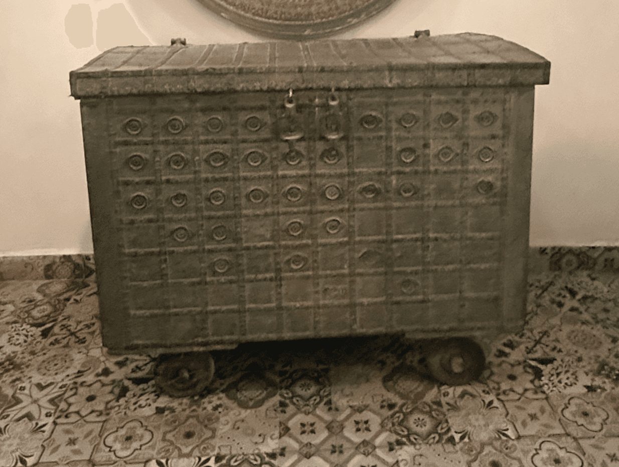 A large, rectangular storage chest with an arched lid, crafted from distressed metal. The entire sur… — 3D model