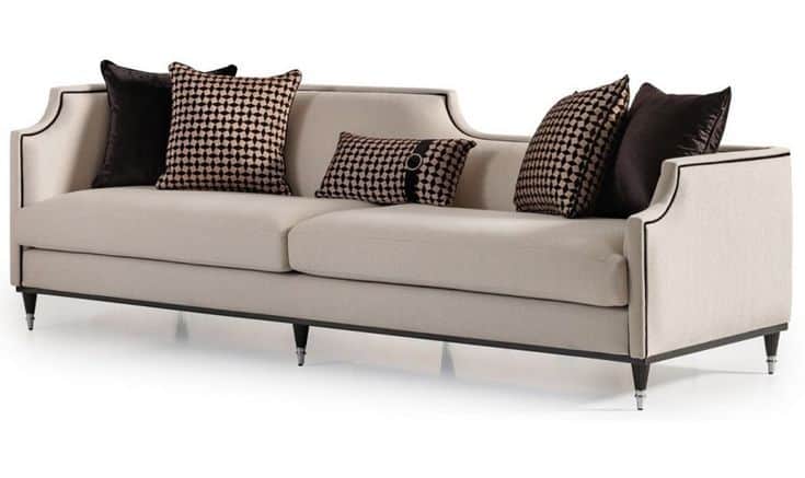 A contemporary three-seater sofa featuring a clean, rectilinear form with subtly curved armrests and… — 3D model