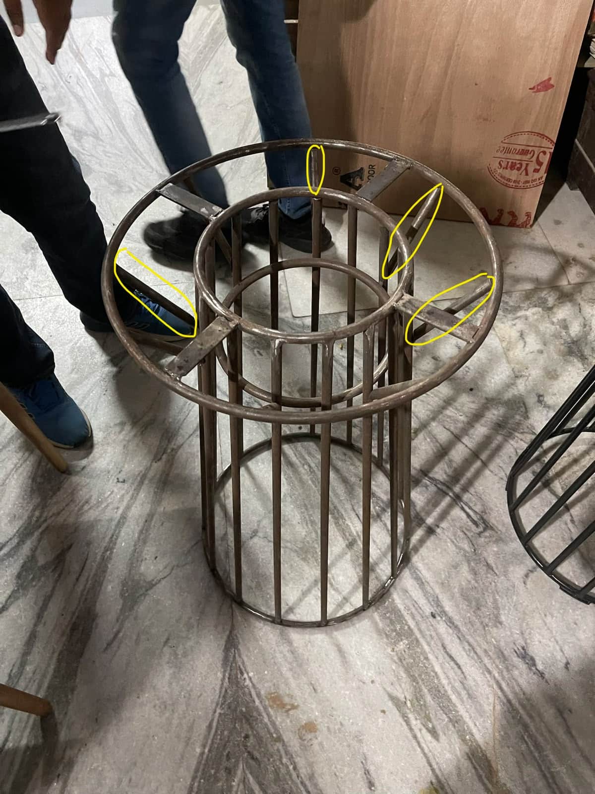A cylindrical, open-cage metal structure designed to serve as a base, likely for a small table or a… — free GLTF 3D model