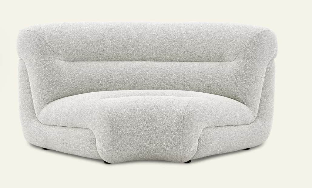 An armless lounge chair upholstered in a light-colored bouclé fabric, featuring a soft, rounded, and… — 3D model