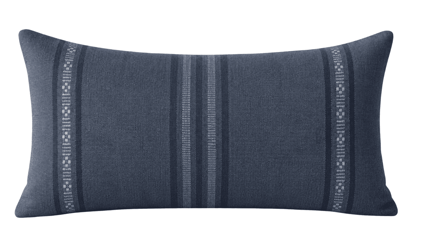 A rectangular lumbar pillow with a textured fabric surface. The pillow features a central pattern of… — 3D model