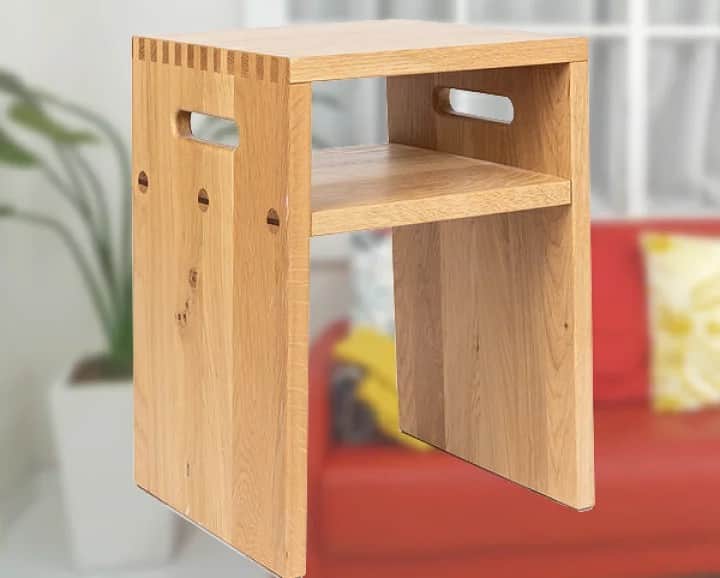 A minimalist wooden stool with a two-tiered design. The stool features a top surface and a lower she… — free OBJ 3D model