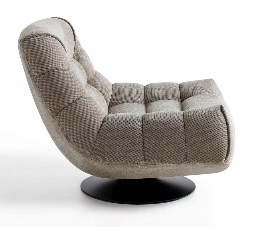 A modern armchair with a low profile and a unique curved silhouette. The armchair features deep tuft… — 3D model