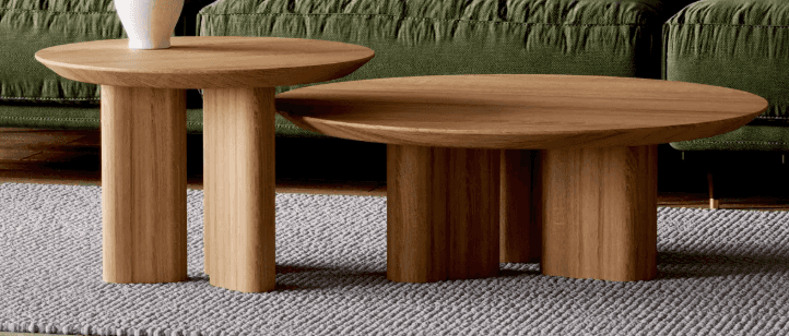 An oval-shaped coffee table with a natural wood finish. The table has a thick, rounded tabletop and… — free OBJ 3D model