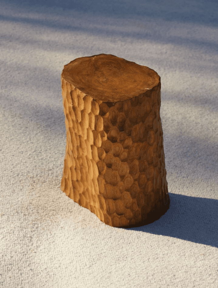 A compact, solid wood side table featuring a distinctive hand-carved, textured surface on its cylind… — 3D model