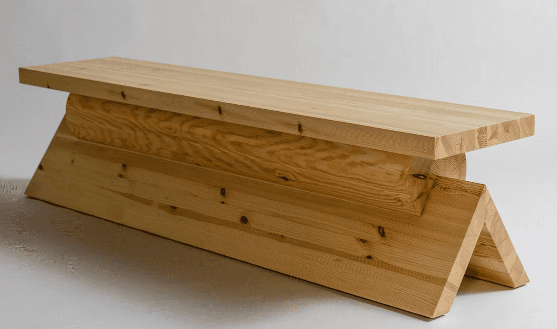 A long, low bench crafted from light-toned solid wood. It features a thick, rectangular top surface… — 3D model