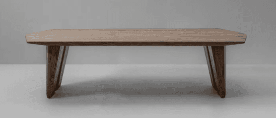 A low-profile rectangular coffee table crafted from solid wood, featuring a light brown finish that… — 3D model
