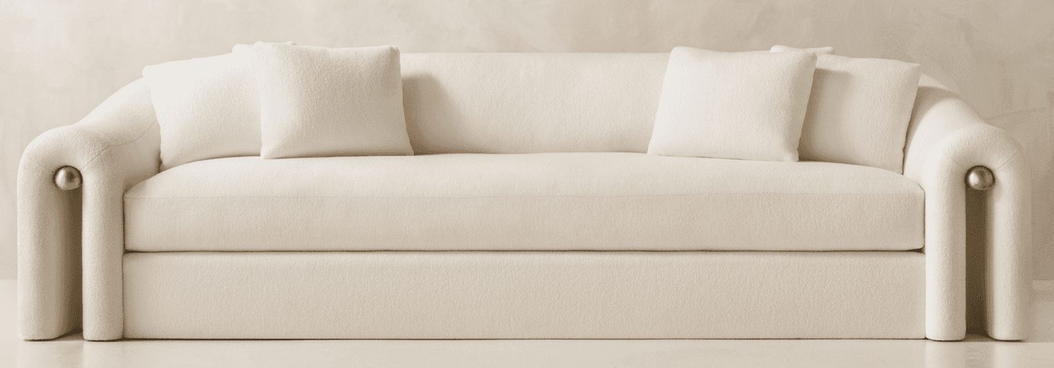 A modern three-seater sofa featuring a distinctive curved silhouette and rolled arms, upholstered in… — free GLTF 3D model