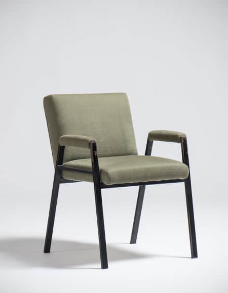 An armchair with a dark-colored frame and upholstered seat, back, and armrests in a light olive gree… — free OBJ 3D model