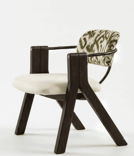 A contemporary armchair featuring a dark brown wooden frame, a cream upholstered seat cushion, and a… — free OBJ 3D model