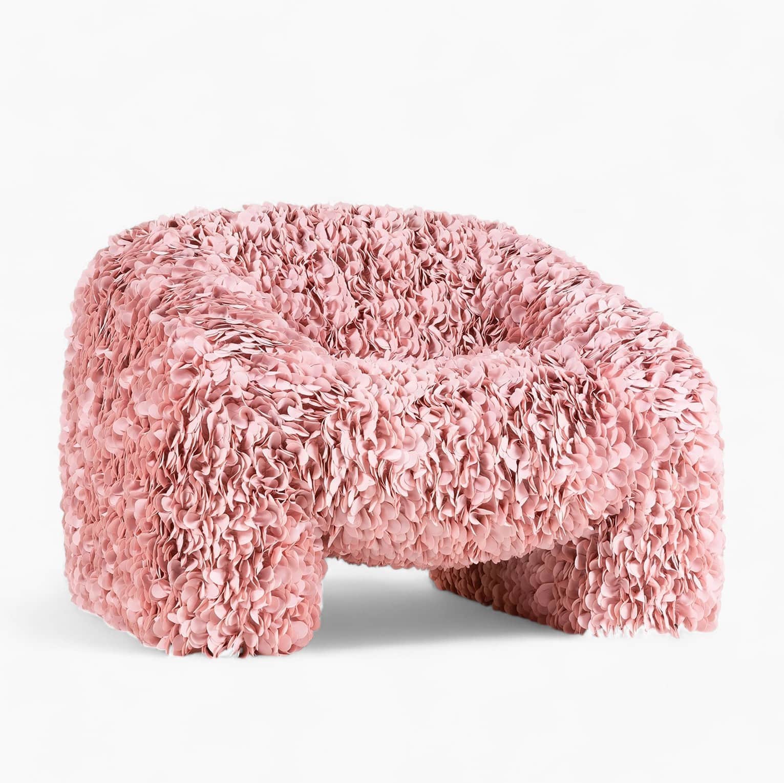 A low-profile armchair with a rounded silhouette, upholstered in a textured fabric composed of numer… — free FBX 3D model