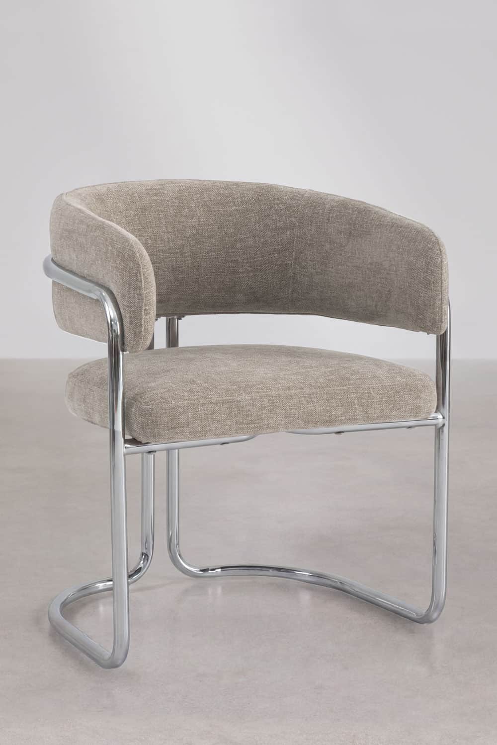 A modern upholstered armchair featuring a curved backrest and seat, supported by a polished chrome t… — free OBJ 3D model