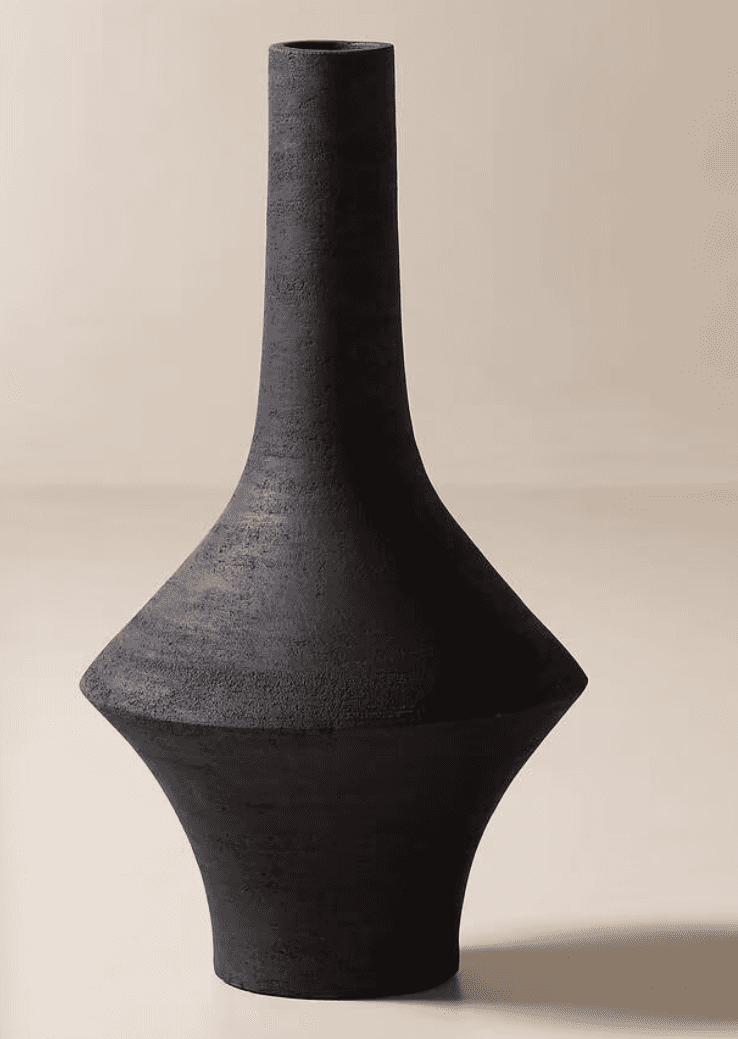 A tall, black decorative vase with a geometric and sculptural form. It features a narrow, cylindrica… — 3D model