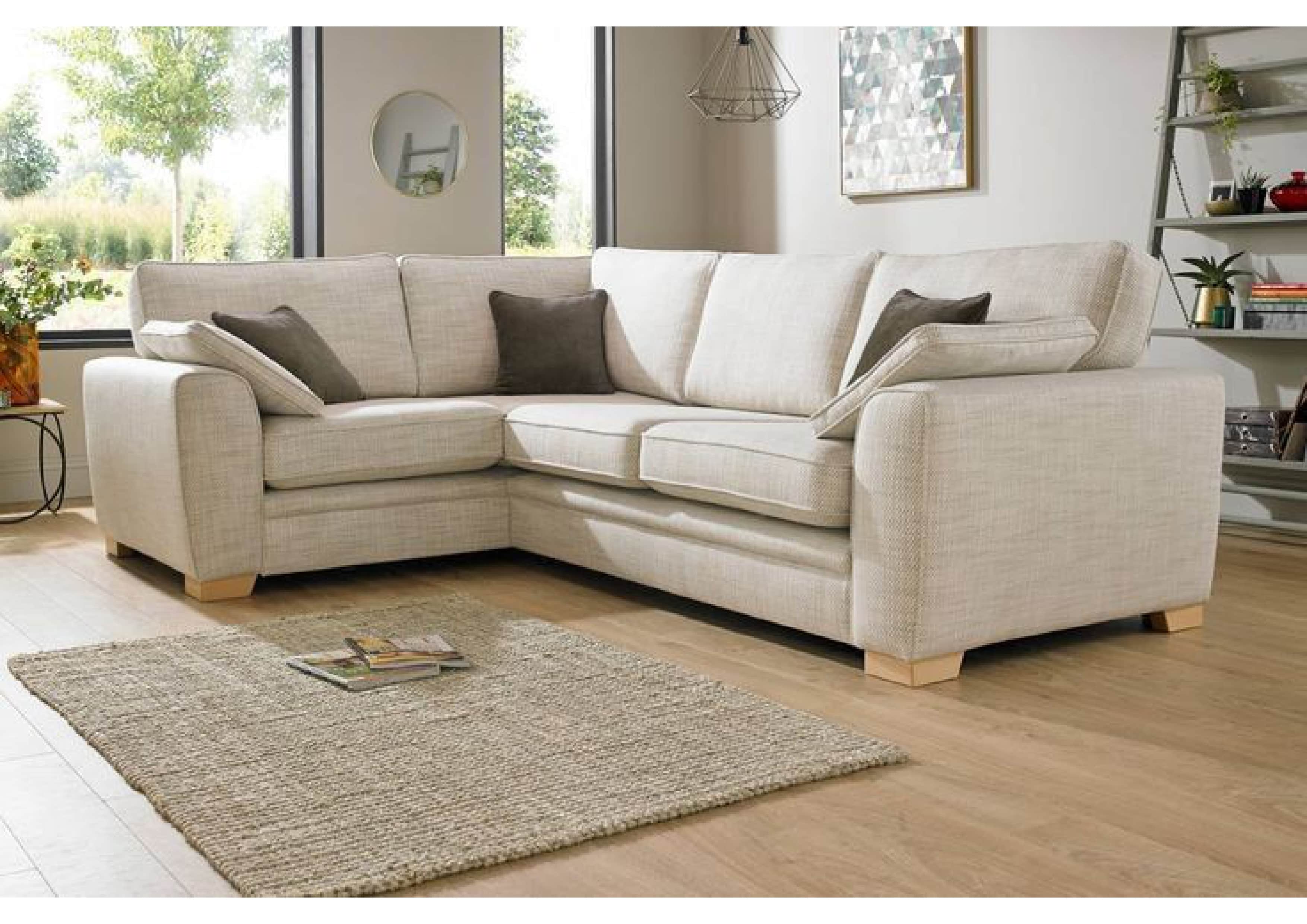 An L-shaped sectional sofa upholstered in a light beige or cream fabric. The sofa features a modern,… — 3D model