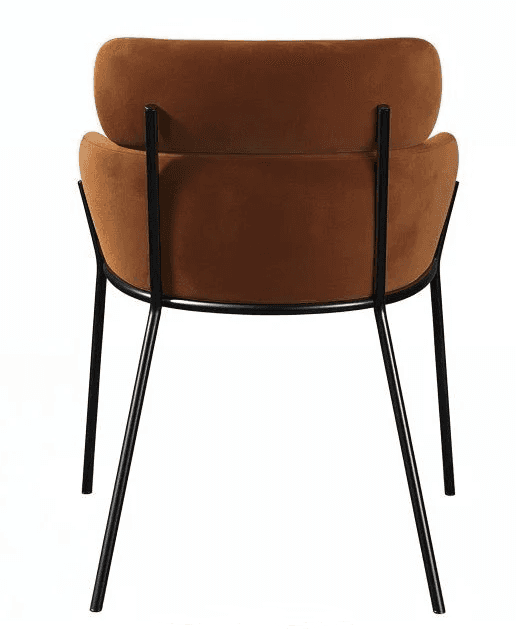 A modern dining chair featuring a rounded, padded seat and backrest upholstered in a rich rust-color… — 3D model