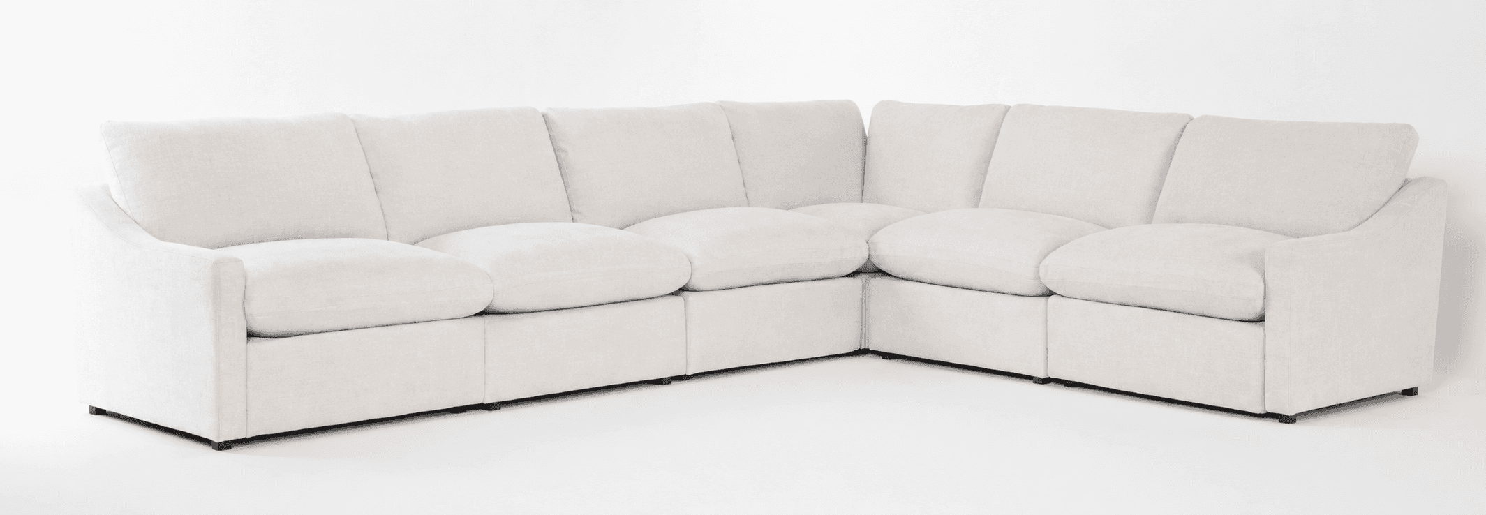 An off-white or cream-colored modular sectional sofa, configured in an L-shape. It features deep, pl… — 3D model