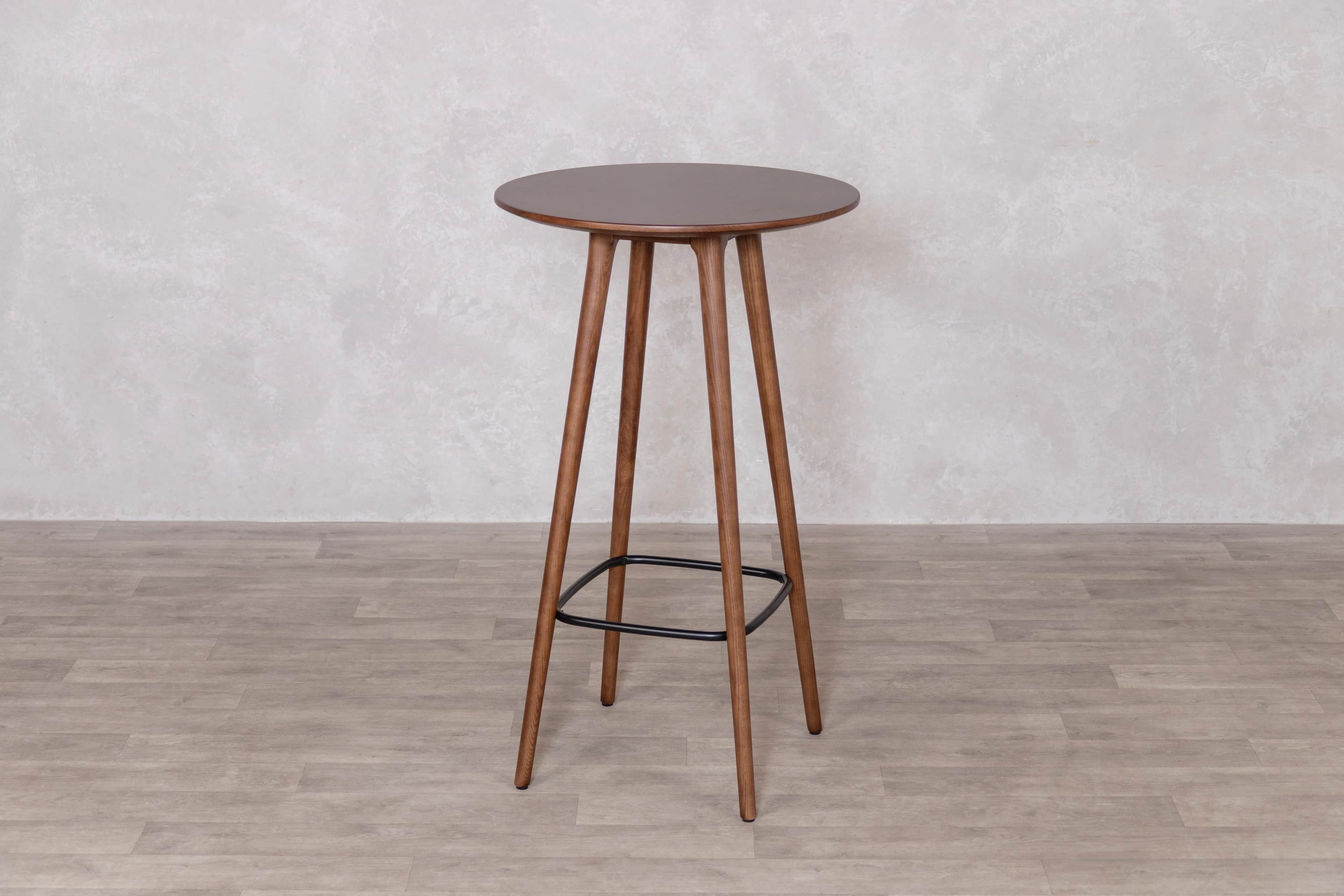 A tall, round bar table featuring a dark walnut-finished tabletop supported by three splayed wooden… — 3D model