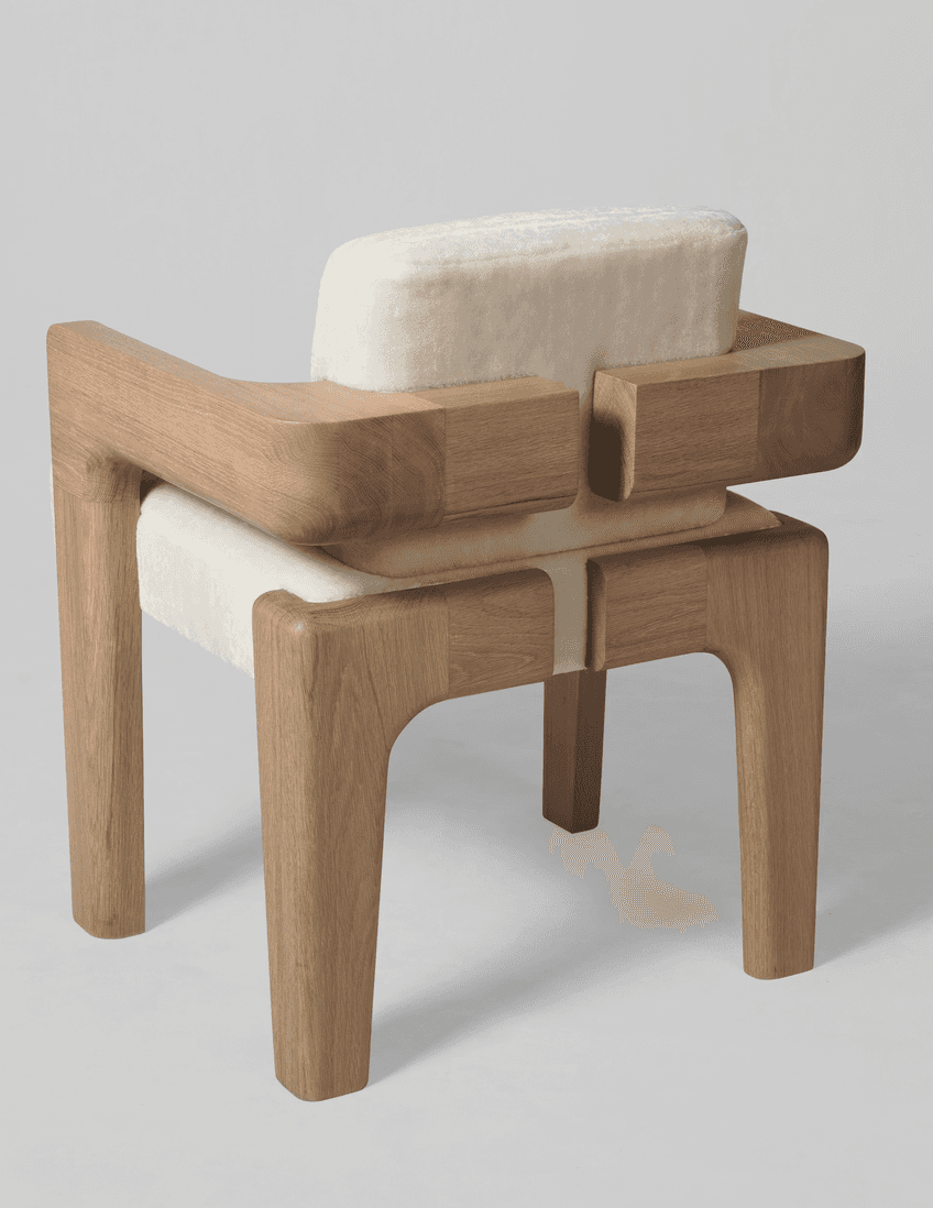 An armchair with a distinct contemporary design. The frame is constructed from light-colored wood wi… — 3D model