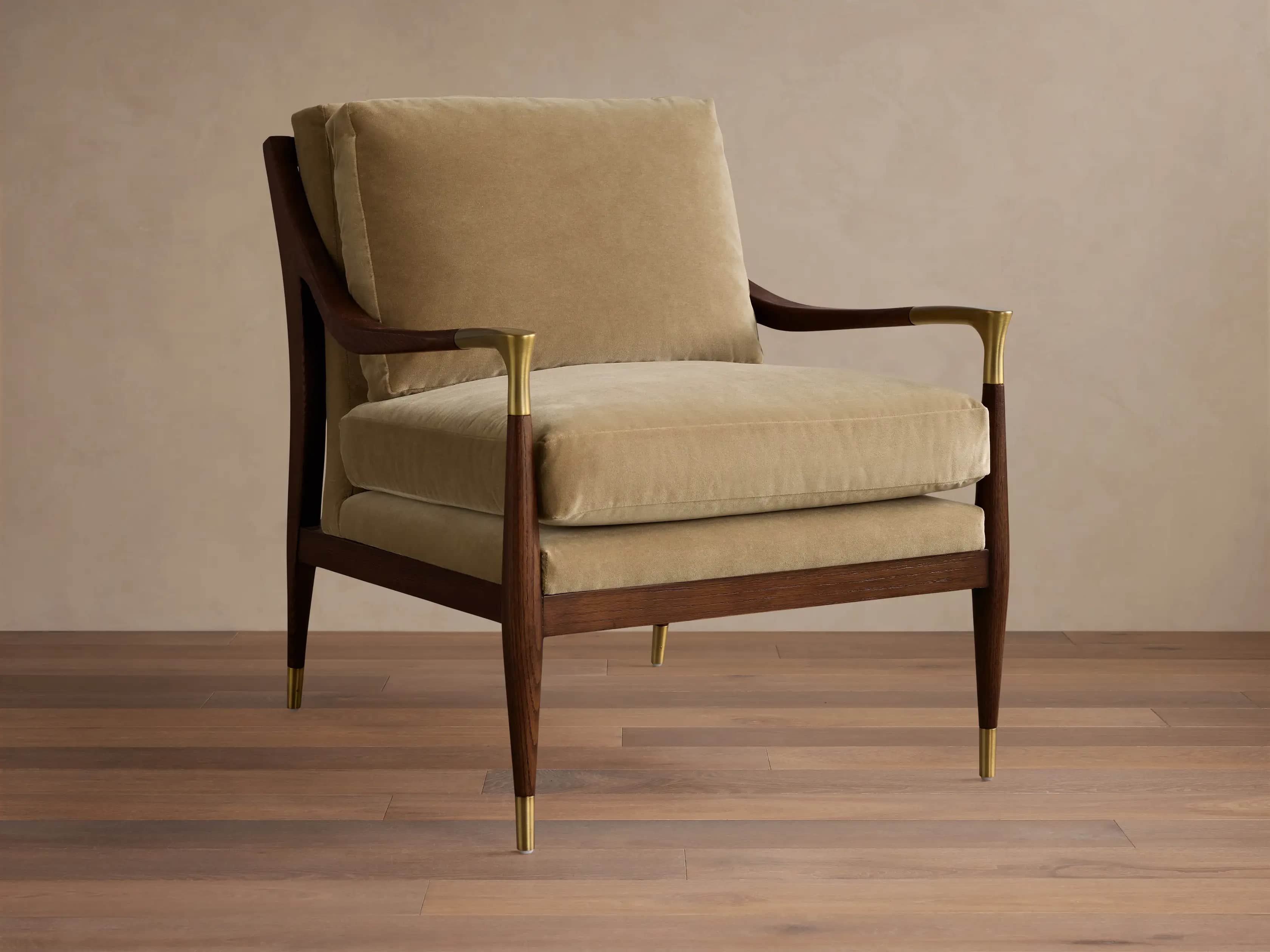 A plush armchair with a wooden frame and velvet upholstery. The armchair features a high back and se… — 3D model