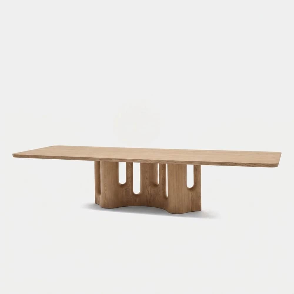 A light-toned oak wood coffee table featuring a rectangular tabletop with gently rounded corners, su… — 3D model