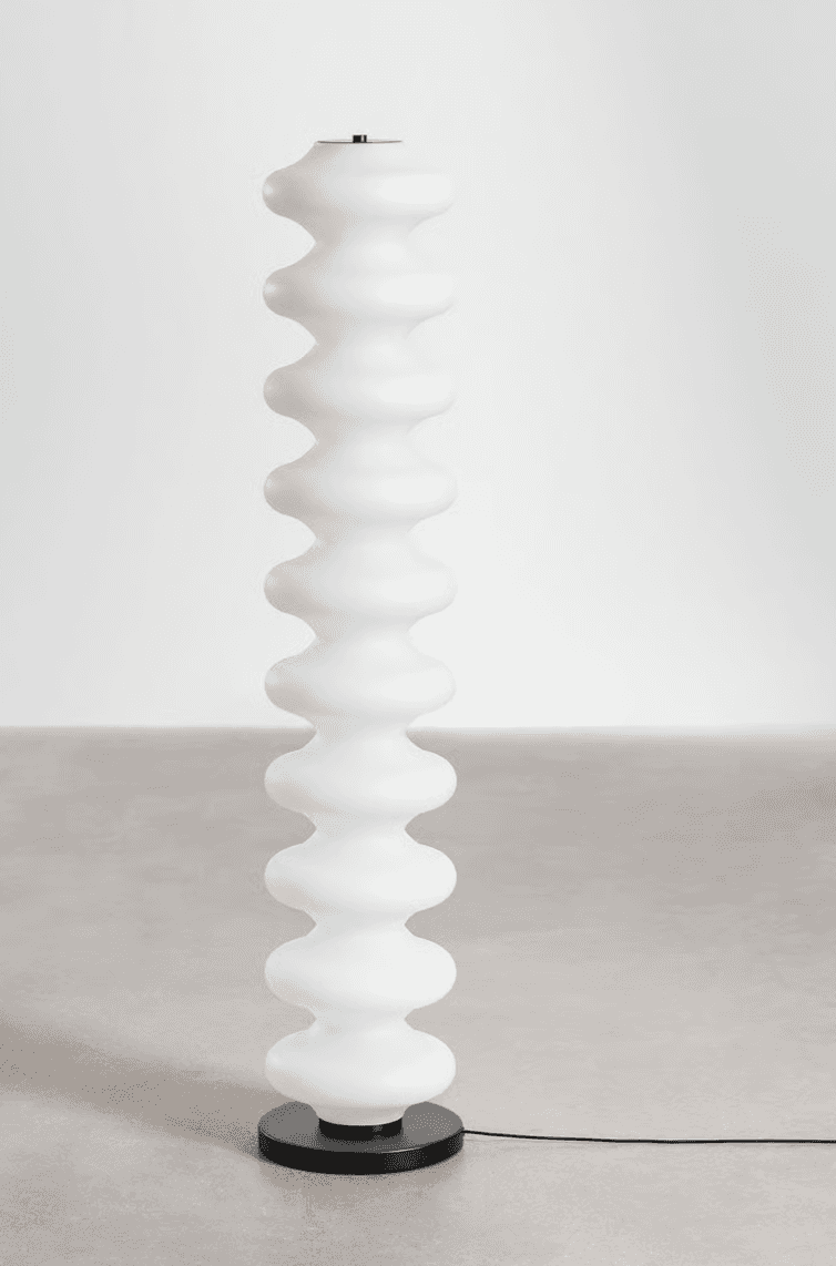 A tall, slender contemporary floor lamp featuring a column of stacked, frosted ovoid segments. The s… — 3D model
