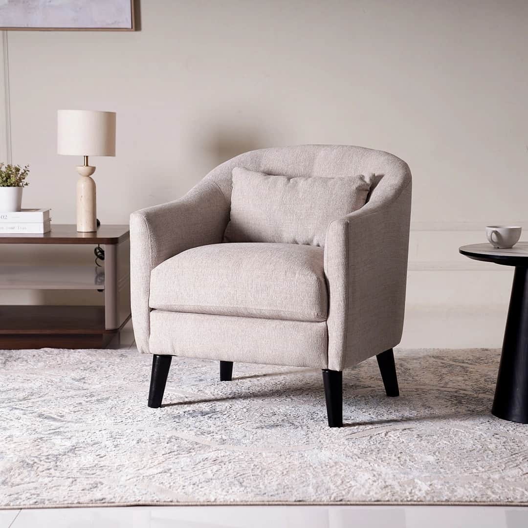 A contemporary upholstered club chair featuring a rounded back, integrated armrests, a single seat c… — 3D model