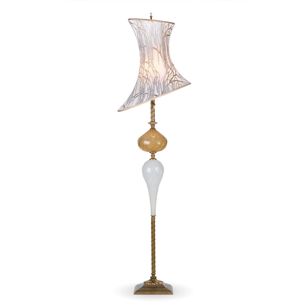 A tall, ornate floor lamp featuring a distressed brass finish base and stem, supporting a multi-part… — 3D model