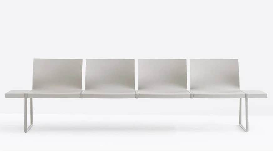 A long, grey, multi-seat bench designed for public waiting areas, featuring four individual seating… — free STL 3D model
