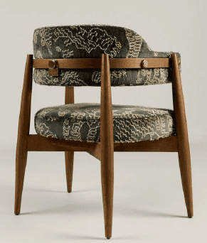 An upholstered armchair with a wooden frame, featuring a dark teal velvet fabric with a light-colore… — 3D model