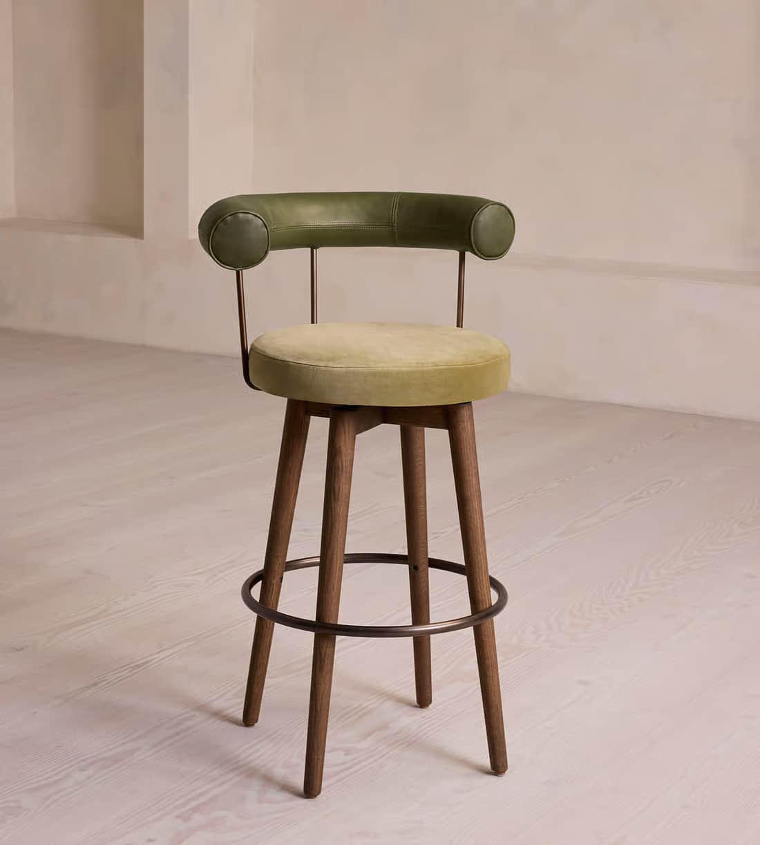 A modern bar stool featuring a rounded upholstered seat and a distinctive curved, padded backrest, s… — 3D model