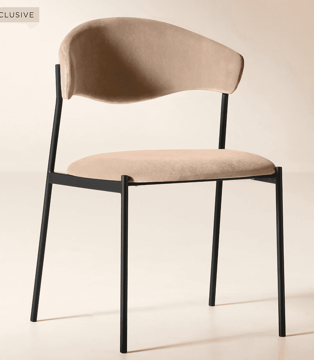 A modern dining chair featuring a black metal frame and light beige upholstered seat and a distincti… — 3D model